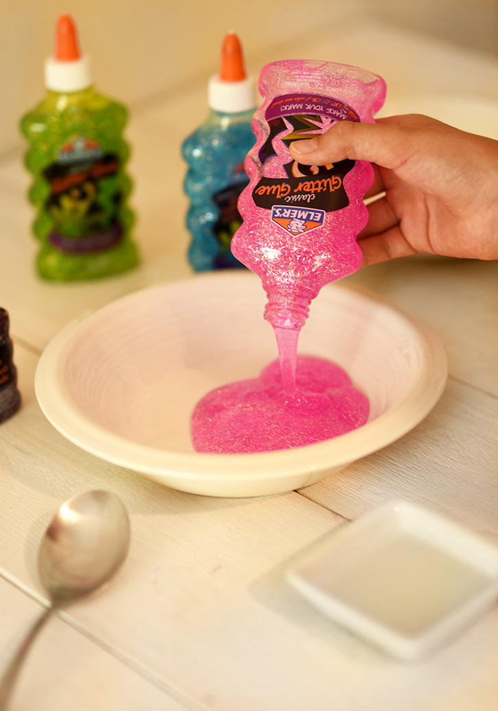 How To Make Rainbow Slime - Pour Pink Elmers Glitter Glue Into A Bowl - Cool and Easy Crafts for Kids and Teens - Ingredients and Step by Step Tutorial for Making Slime At Home - Cheap DIY Projects for Teens and Teenagers - Girls and Boys Love Making Slime